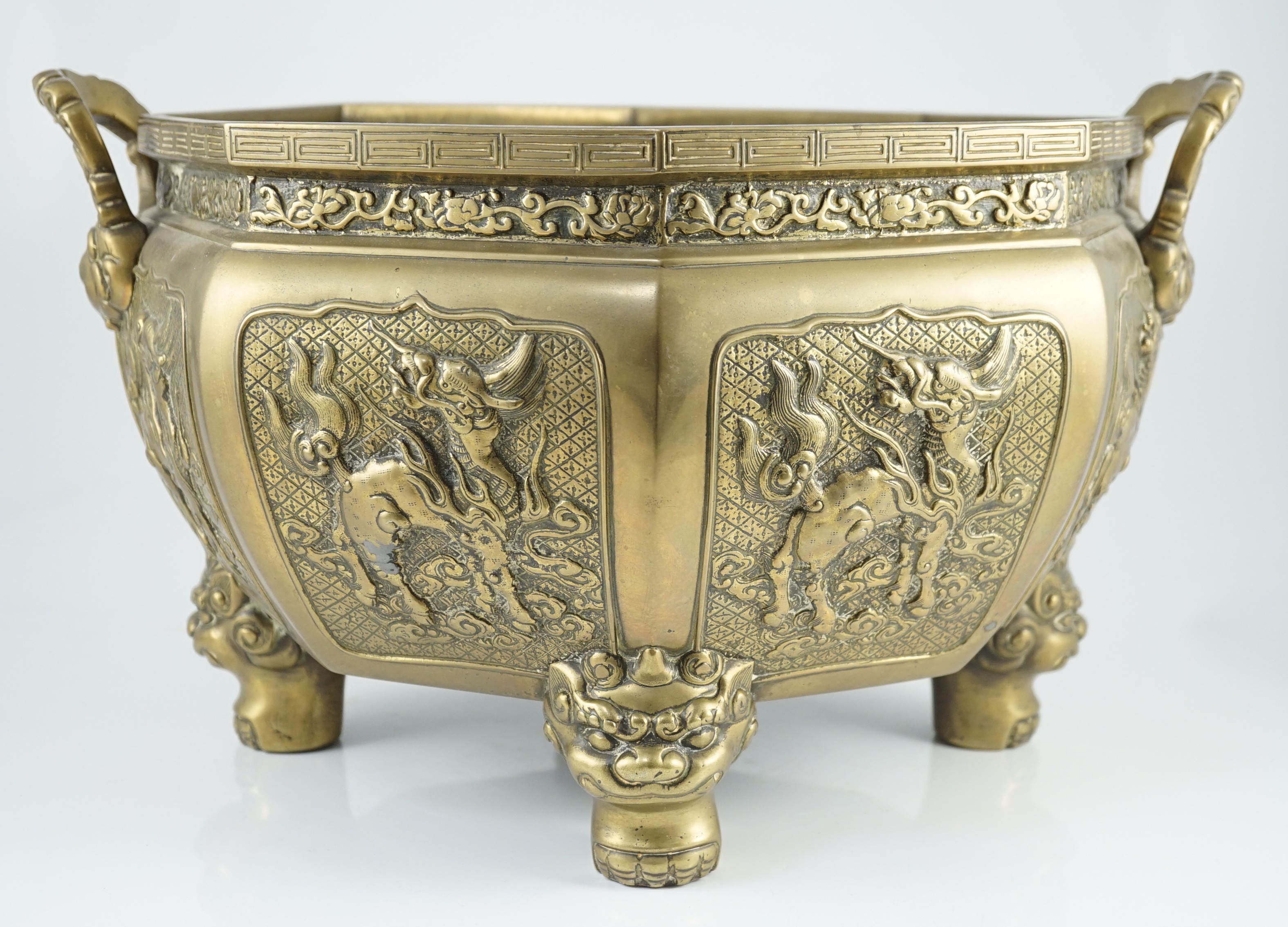 A large Chinese polished bronze octagonal jardiniere, 19th century, 48cm wide at handles, slight faults